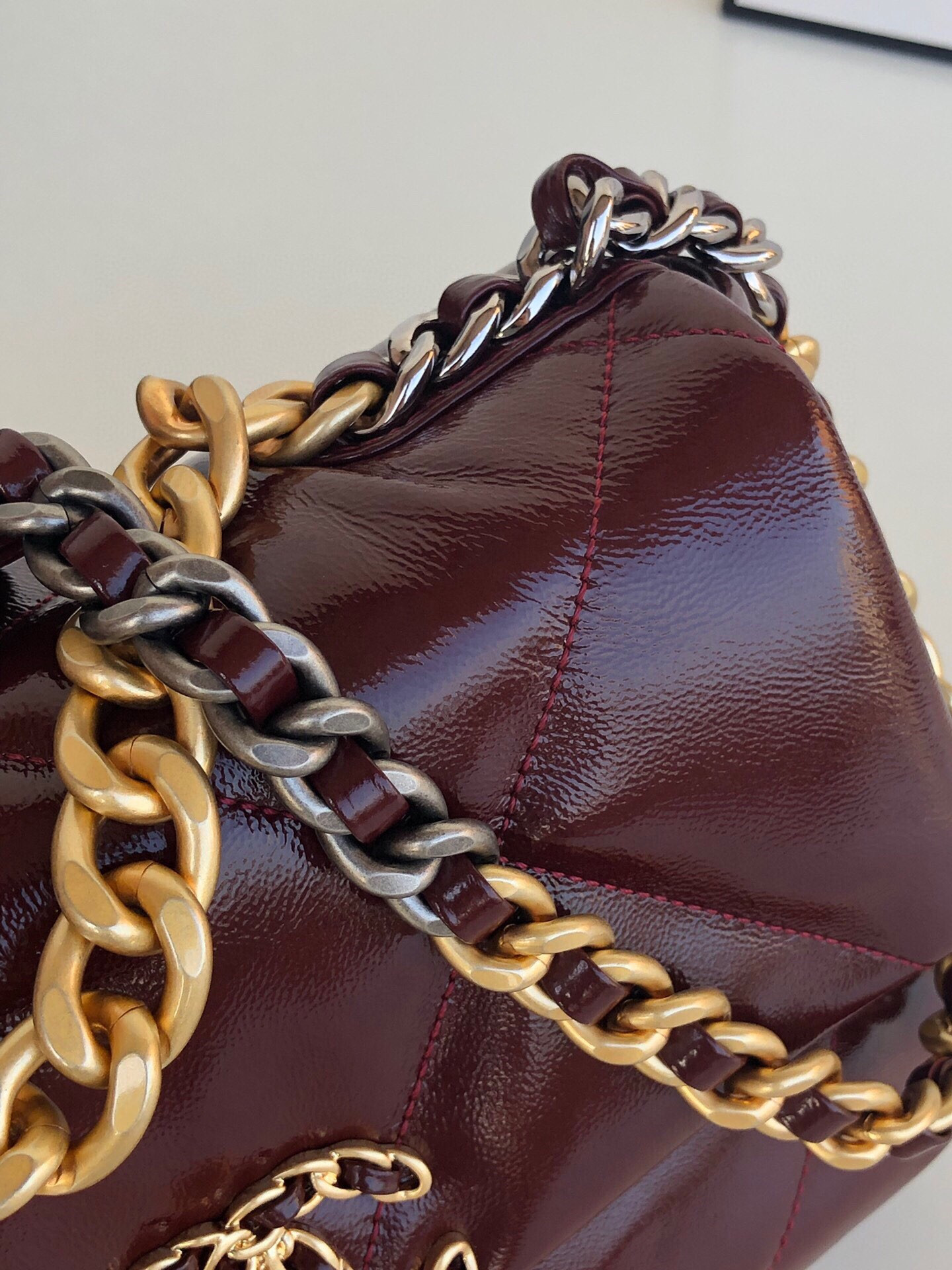 Ch*el 19 handbag shiny leather, gold-tone, silver-tone & ruthenium-finish metal dark red 6.2 × 10.1 × 3.5 in