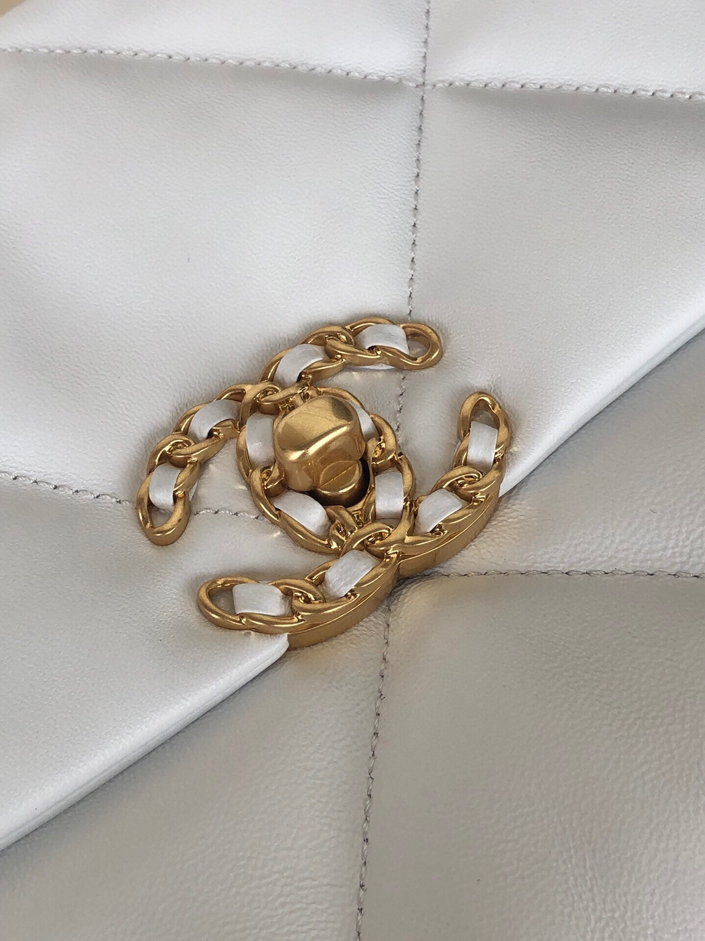 Ch*el 19 large handbag shiny leather, gold-tone, silver-tone & ruthenium-finish metal white 7.8 × 11.7 × 3.9 in