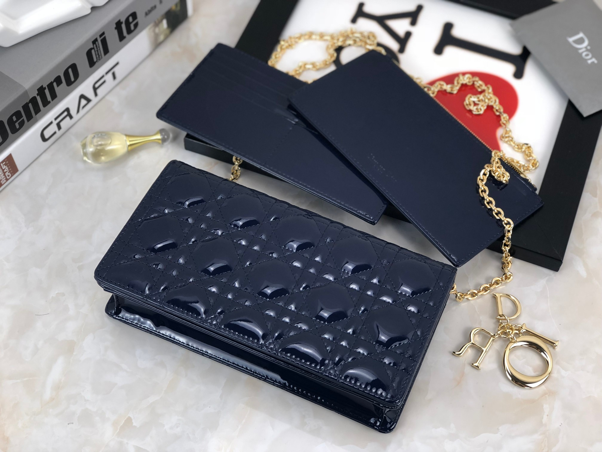 lady D*or pouch  navy patent cannage calfskin 8.5 x 4.5 x 1 inches