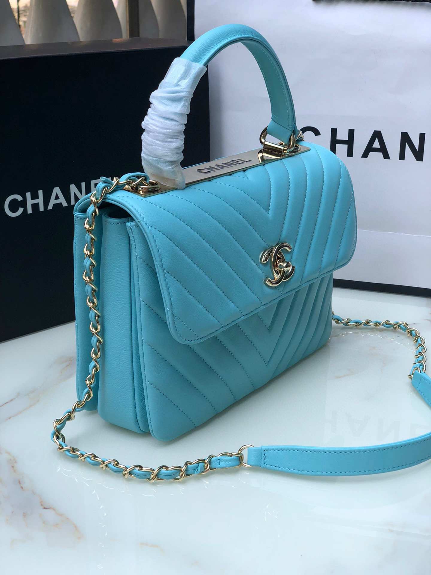 Ch*el flap bag with top handle 6.6 × 9.8 × 4.7 in