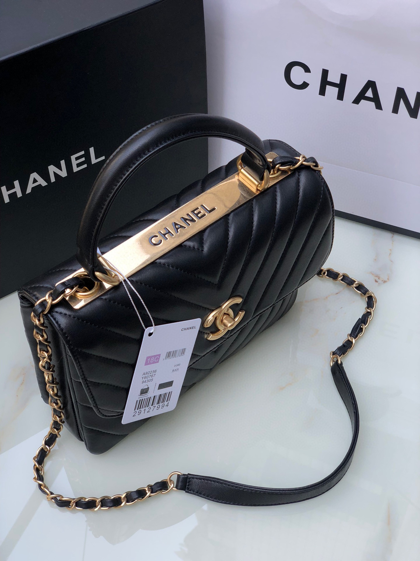 Ch*el flap bag with top handle 6.6 × 9.8 × 4.7 in