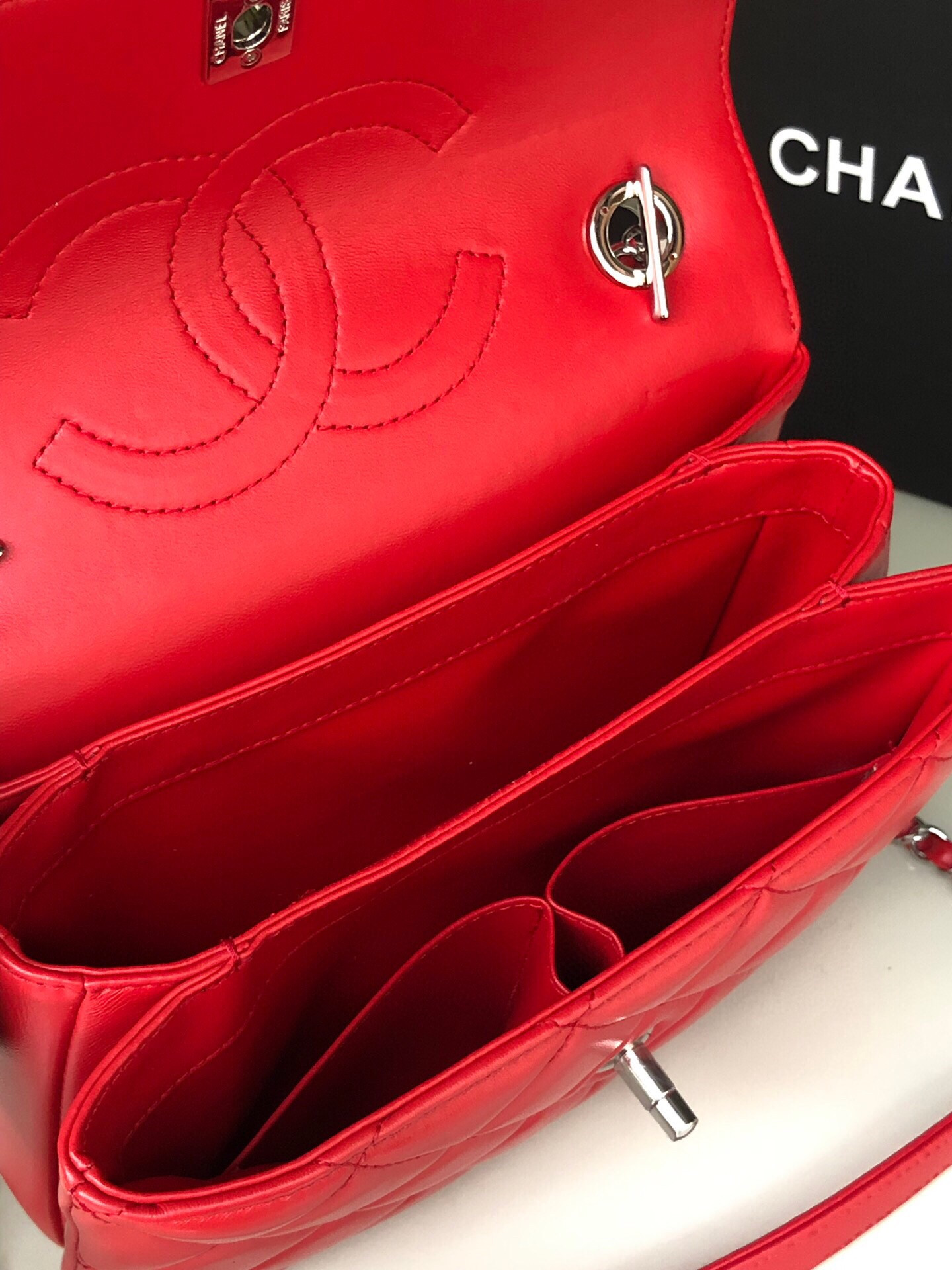 Ch*el flap bag with top handle 6.6 × 9.8 × 4.7 in