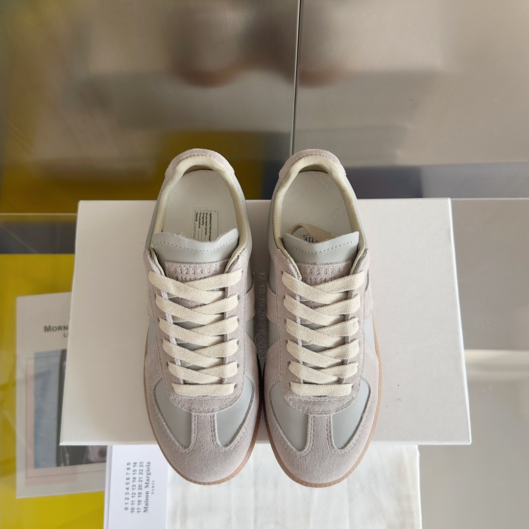 ua ma*s*n Ma*i*la mm6 sneakers