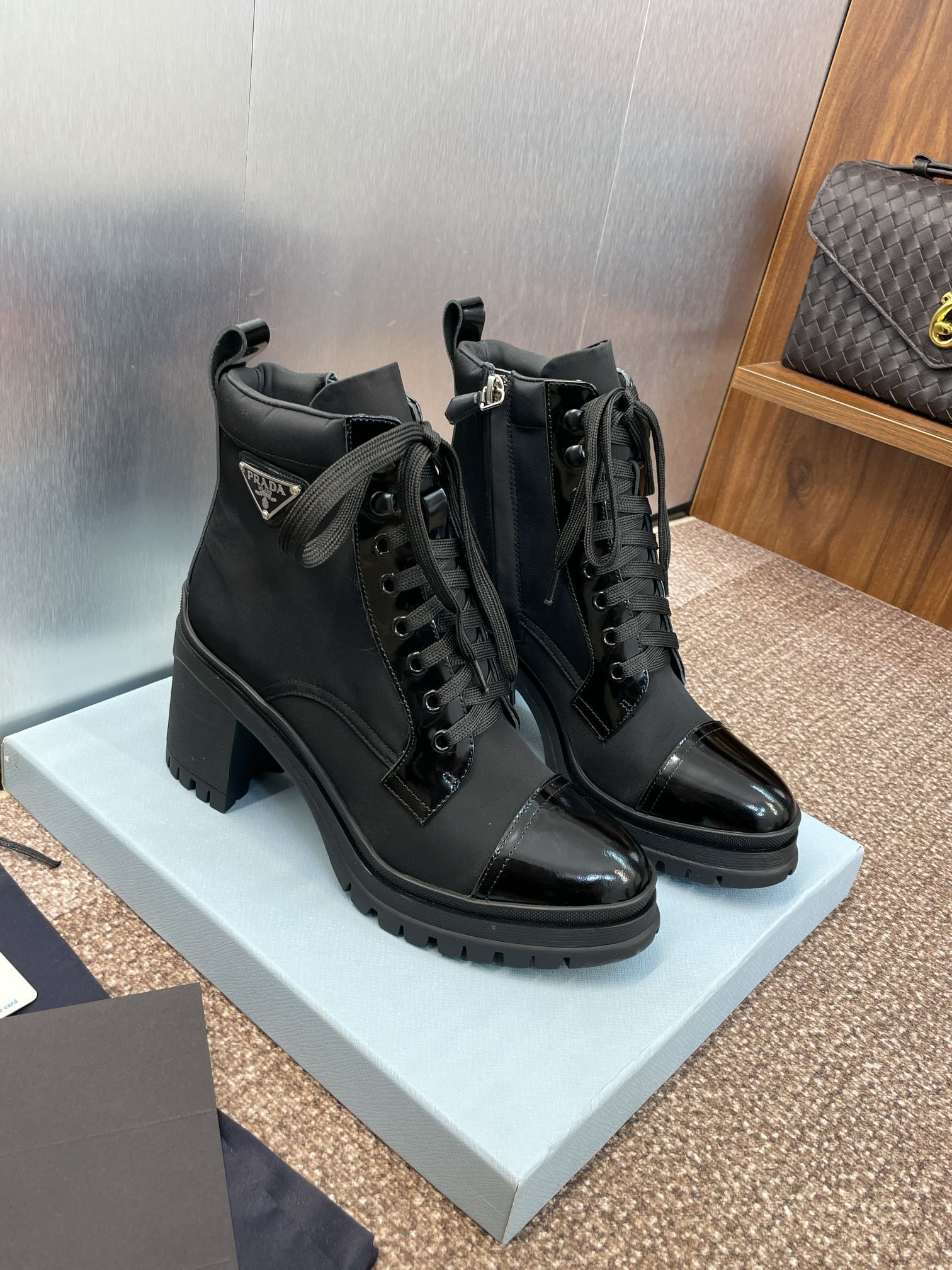 ua Pra*a re-nylon and leather booties