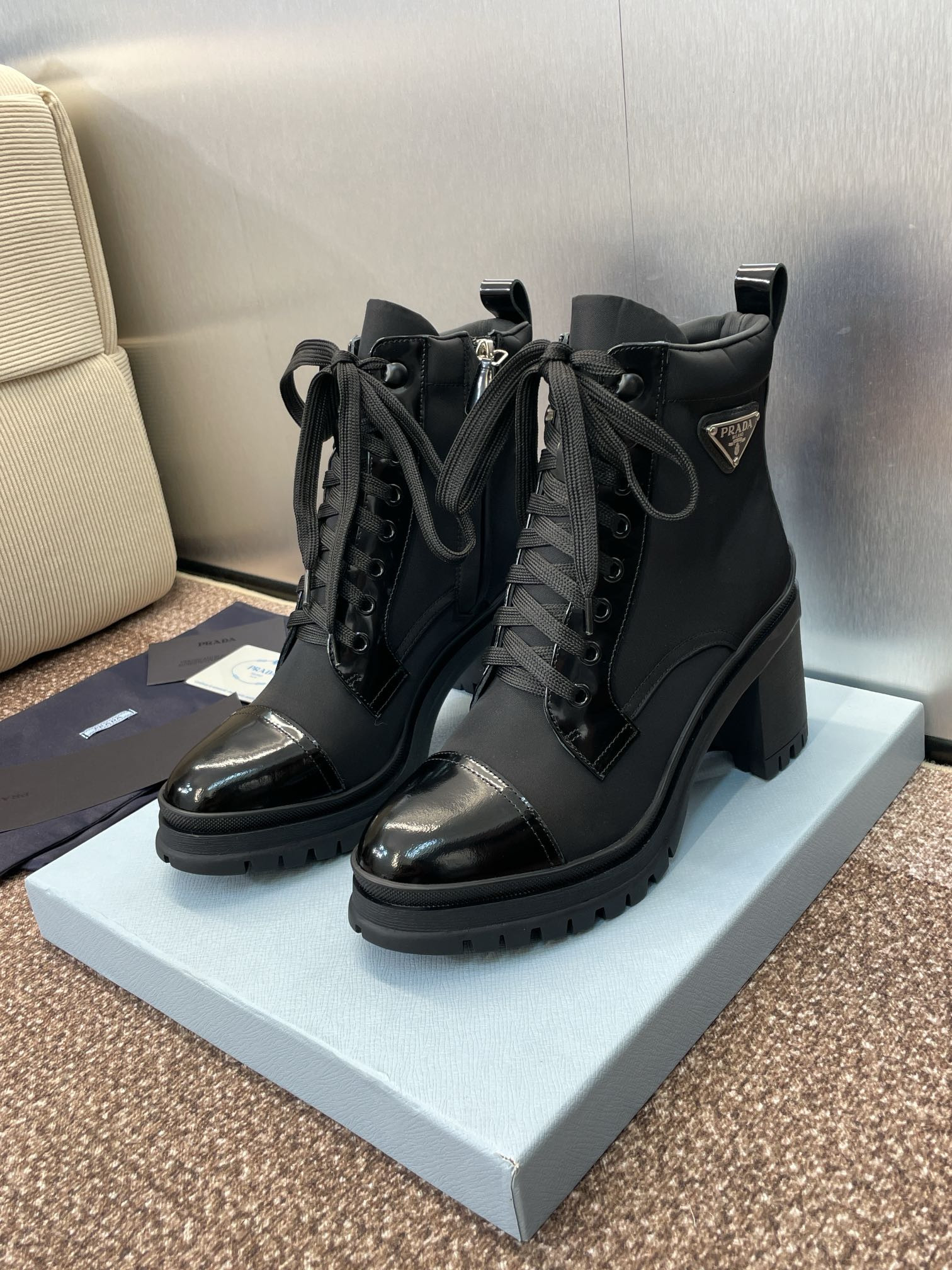 ua Pra*a re-nylon and leather booties