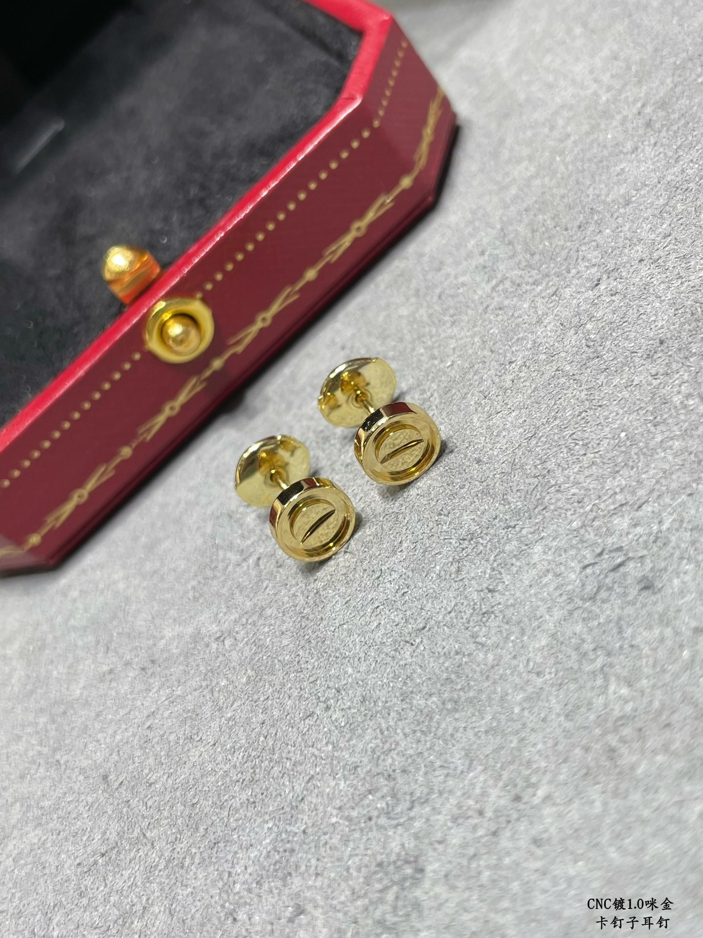 Ca*t1er nail earrings