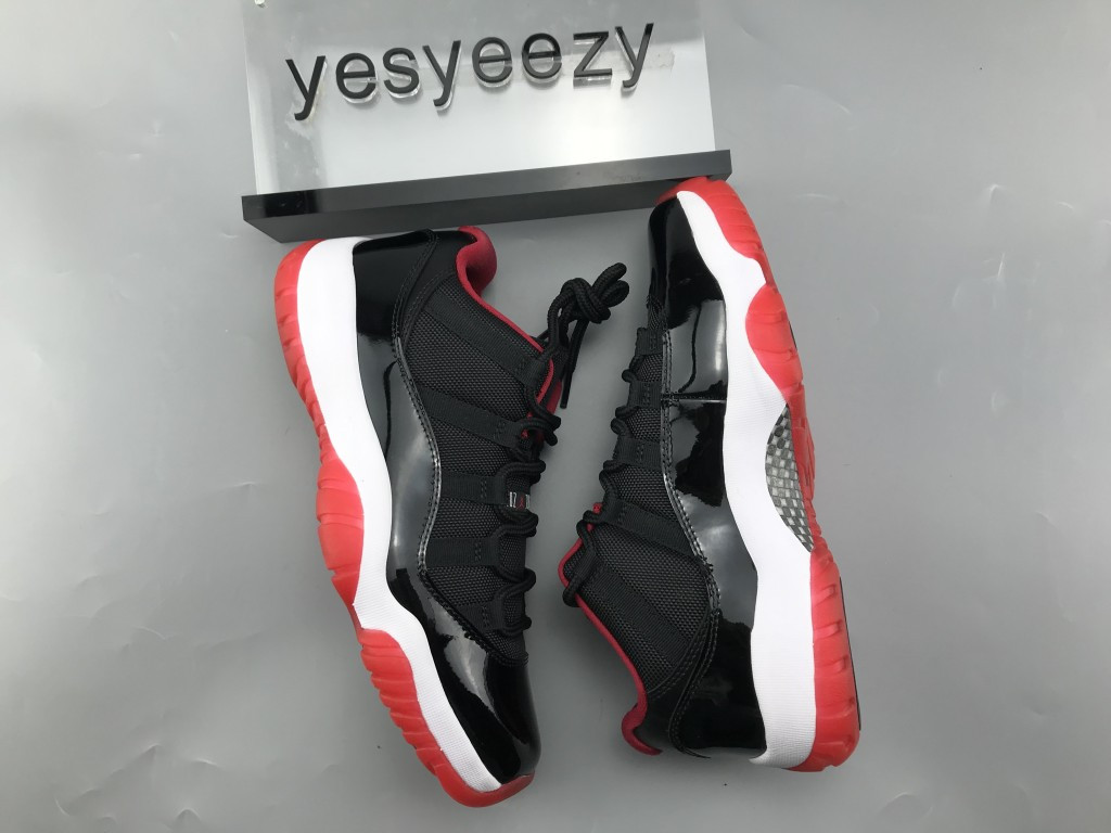 UA AIR JORDAN 11 RETRO LOW BRED