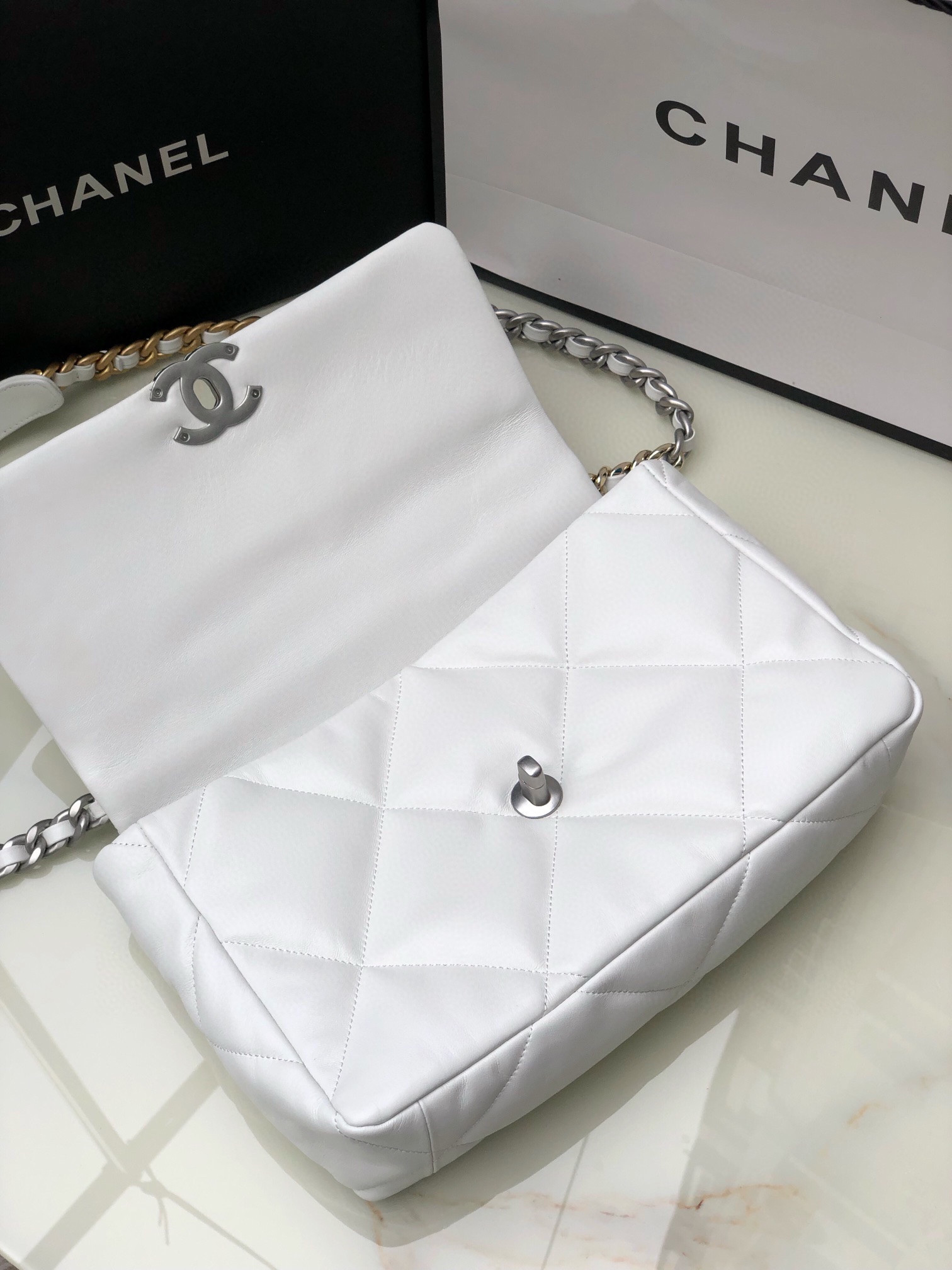 Ch**el 19 LARGE HANDBAG Shiny Leather, Gold-Tone, Silver-Tone & Ruthenium-Finish Metal White 7.8 × 11.7 × 3.9 in