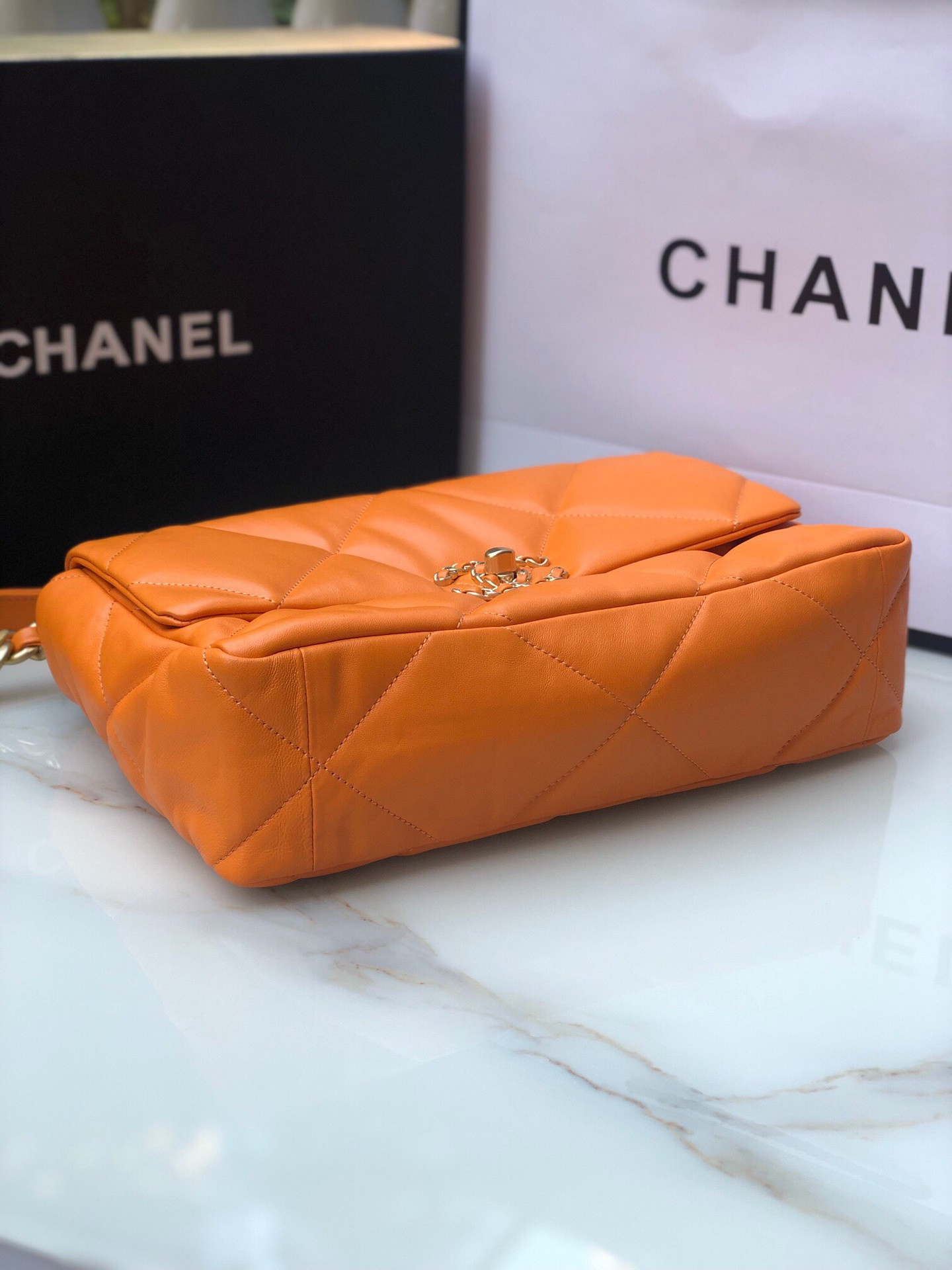 Ch**el 19 LARGE HANDBAG Shiny Leather, Gold-Tone, Silver-Tone & Ruthenium-Finish Metal Orange 7.8 × 11.7 × 3.9 in