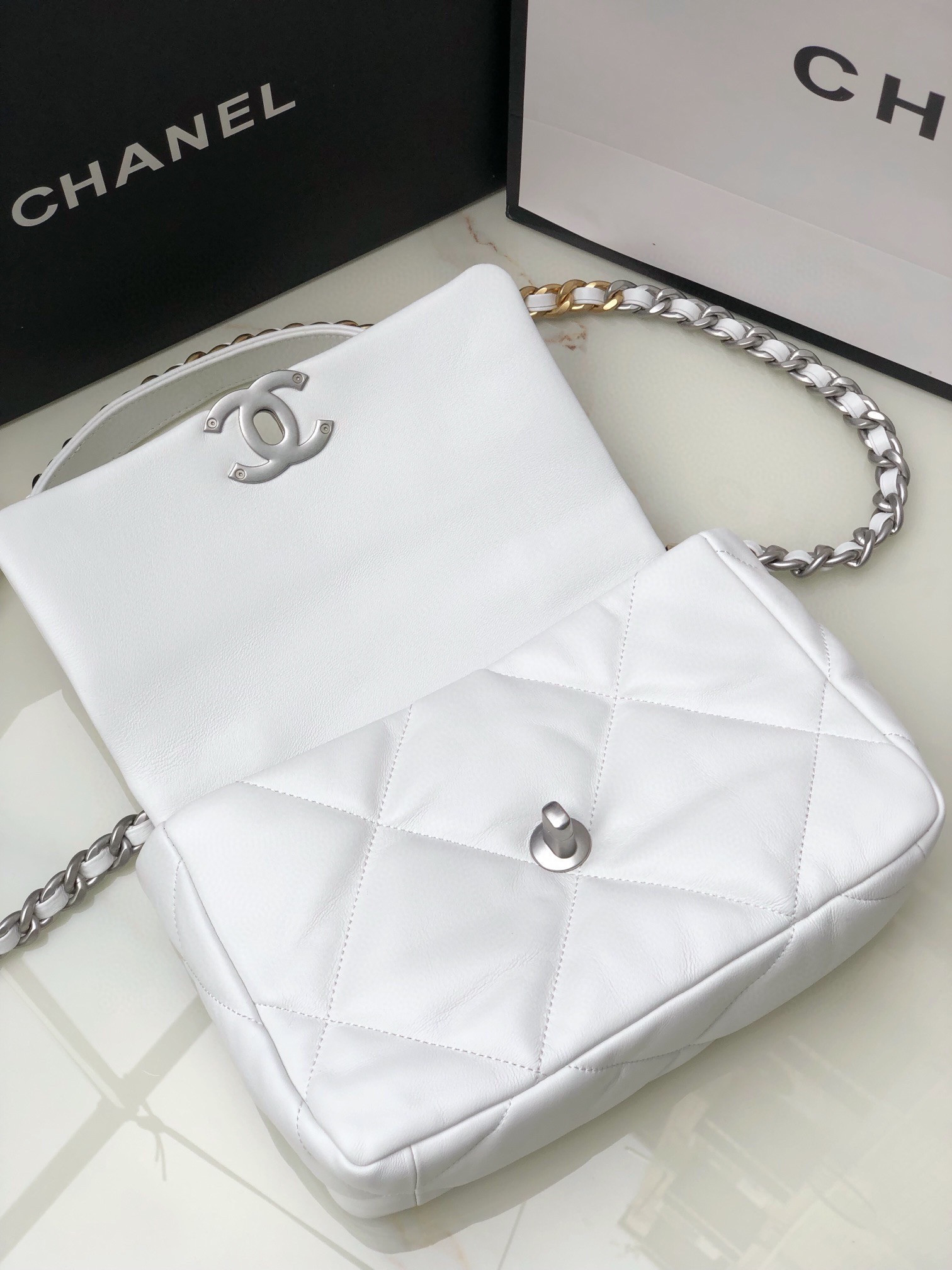 Ch**el 19 HANDBAG Shiny Leather, Gold-Tone, Silver-Tone & Ruthenium-Finish Metal White 6.2 × 10.1 × 3.5 in