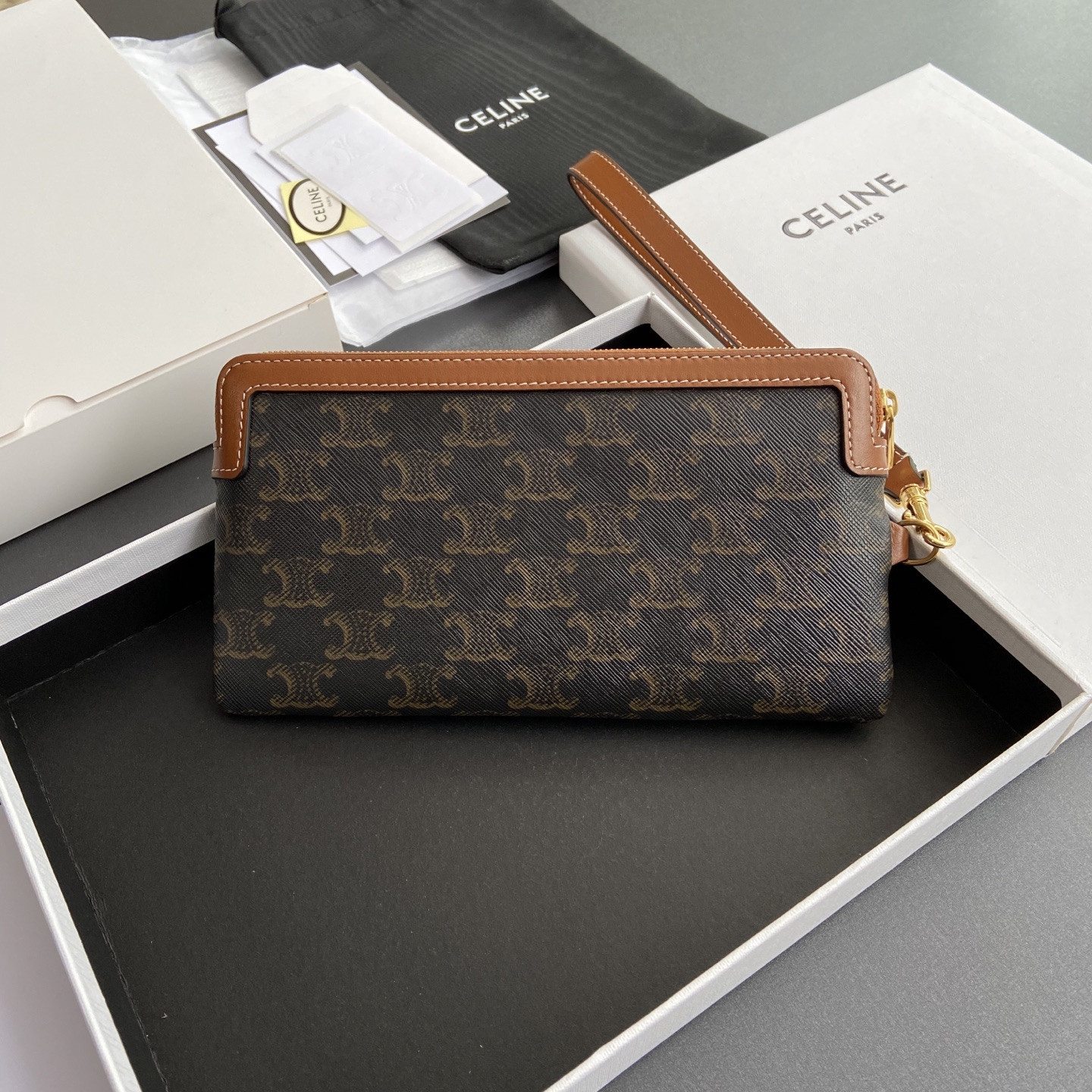 Ce1i*e LONG POUCH WITH STRAP in triomphe canvas and calfskin 21.5x11.5x1cm